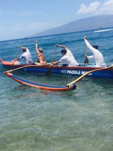Sport paddle a Hawaiian Outrigger Canoe and have fun with friends.