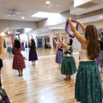 women dancing in traditional skirts